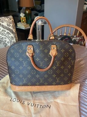 Pre-owned and Authentic Louis Vuitton Monogram Alma Satchel in Brown and Tan